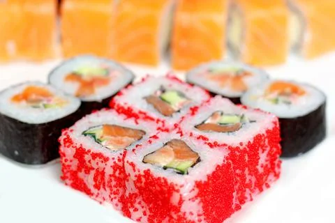 Set of different types of sushi on a white plate Stock Photos