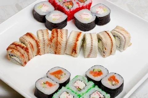 Set of different types of sushi on a white plate 写真素材