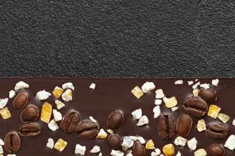 Set of different varieties of chocolate on dark stone background. Stock Photos