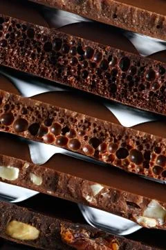 Set of different varieties of chocolate with nuts, raisins and fruit. Foto stock