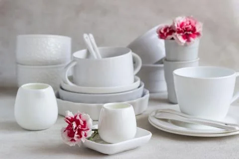 Set of different white ceramic dishes. Elegant white tableware. Foto stock
