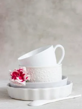 Set of different white ceramic dishes. Elegant white tableware. Stock Photos