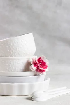 Set of different white ceramic dishes. Elegant white tableware. Stock Photos