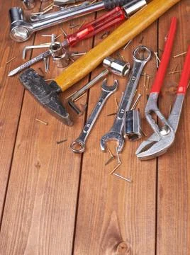 Set of different work tools on wooden surface Stock Photos