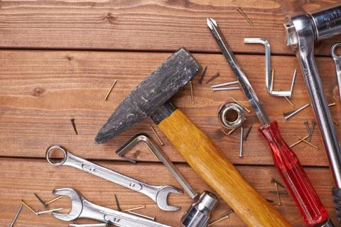Set of different work tools on wooden surface Stock Photos