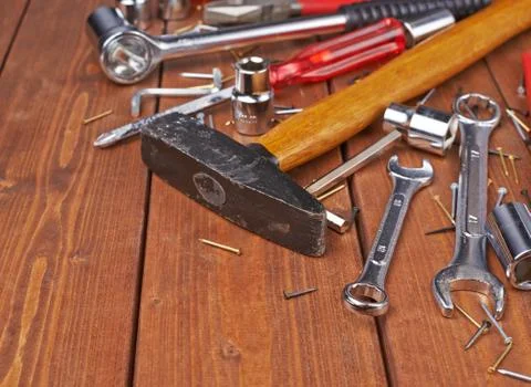 Set of different work tools on wooden surface Stock Photos