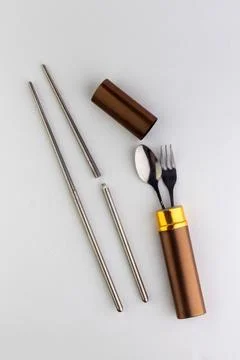 A set of dining items for camping: small spoon and fork, storage case Stock Photos