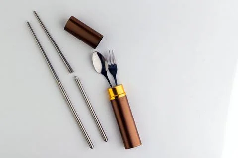 A set of dining items for camping: small spoon and fork, storage case Stock Photos