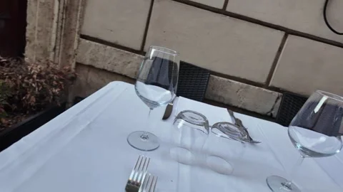 Set dining table on a charming cobblestone street in Rome, Italy Stock-Footage 339780733