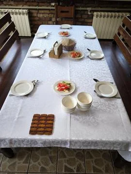 A set dining table for a group in a cozy cafe or restaurant 스톡 사진