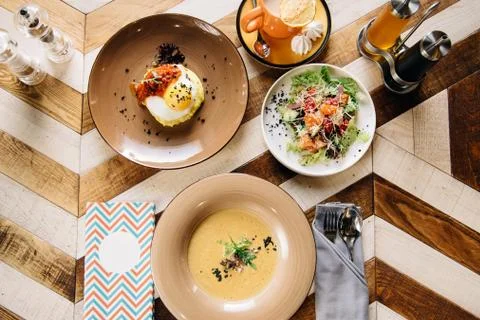 Set dinner of three courses. Chef's specialty presented in restaurant on serv Stock Photos