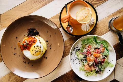 Set dinner of three courses. Chef's specialty presented in restaurant on serv Stock Photos