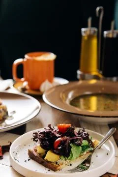 Set dinner of three courses. Chef's specialty presented in restaurant on serv Stock Photos