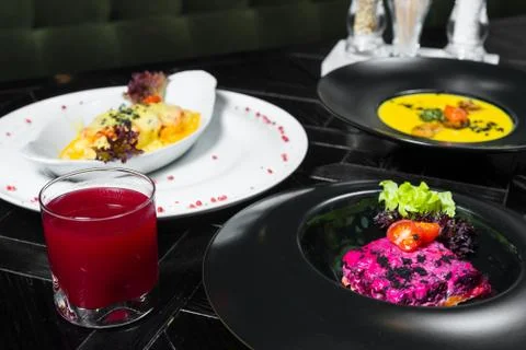 Set dinner of three courses. Chef's specialty presented in restaurant on serv Stock Photos