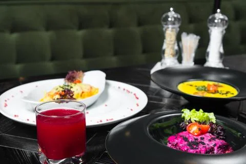 Set dinner of three courses. Chef's specialty presented in restaurant on serv Stock Photos