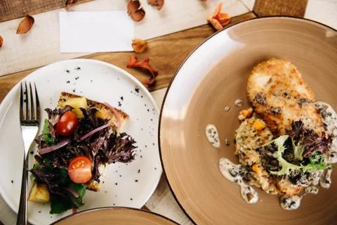 Set dinner of two courses. Chef's specialty presented in restaurant on served Stock Photos