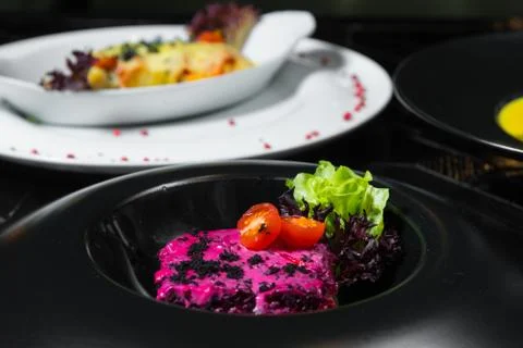 Set dinner of two courses. Chef's specialty presented in restaurant on served Stock Photos