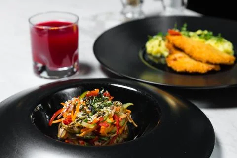 Set dinner of two courses. Chef's specialty presented in restaurant on served Stock Photos