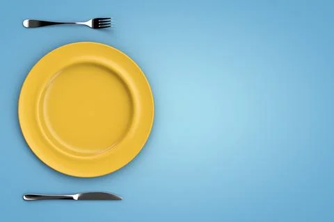 A set of dishes on the table. Empty plate, fork and knife. Stock Photos