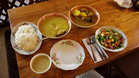 A set of dishes on the table - rice, salad, stew and soup. Stock Footage 201156110