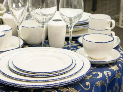 Set of dishes on table Set of dishes close up on table with blue tableclot... Stock Photos