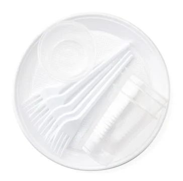 Set of disposable plastic tableware close-up isolated. The view from top Stock Photos
