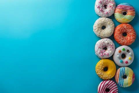 Set of donuts on blue background. Stock Photos