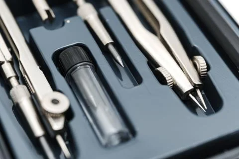 Set of drafting tools in a black case on a white background Stock Photos