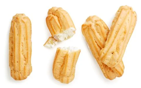 Set of eclairs whole and half on a white background, isolated. Top view Stock Photos