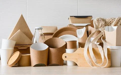 A set of eco-friendly items made of paper, glass, wood and fabric. Stock Photos