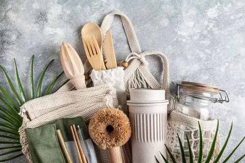 Set of eco friendly  kitchen accessories in a string bag. Stock Photos