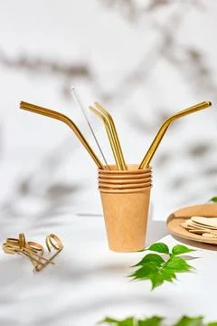 Set of eco friendly tableware, reusable, utensils stainless steel straws Stock Photos