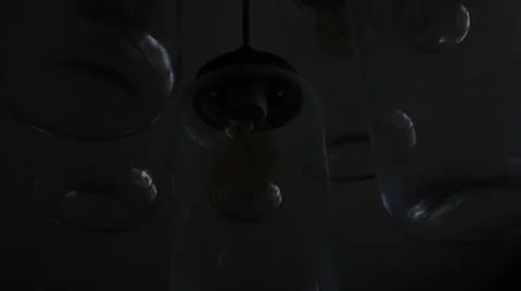 Set of edison light bulbs losing power going on and off Stock Footage 64939134