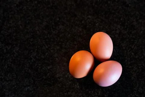 Set of eggs on top of the kitchen marble to make a homemade cake. Stock Photos