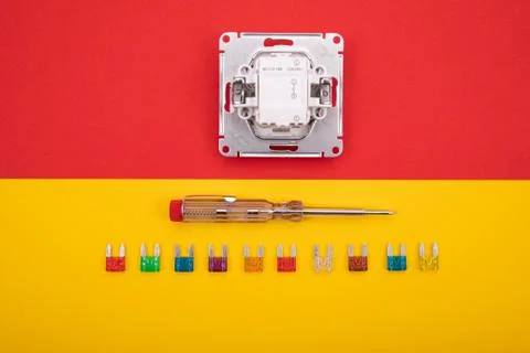 Set of electrical tool and white socket on colorful background Stock Photos
