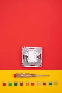 Set of electrical tool and white socket on colorful background Stock Photos