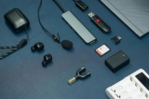 Set of electronic gadgets and computer accessories on blue desk Stock Photos