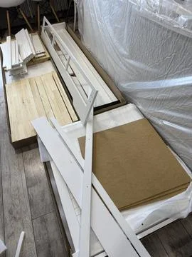 A set of elements for assembling an ottoman. Wooden panels and orthopedic mat Stock Photos