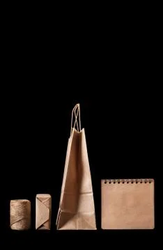 Set of elements from brown kraft paper. Isolated on a black background, side Stock Photos