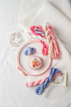 Set for embroidery. Linen fabric, patterns for embroidery, hoops, threads of  Stock Photos