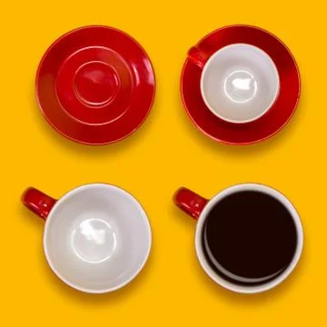 Set of empty and full red cups and a saucers. Coffee set on a yellow backgrou Stock Photos