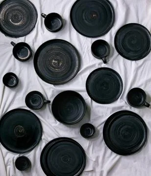 Set of empty black handcrafted ceramic plates Foto stock