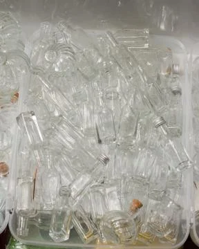 Set of Empty bottles in a box Stock Photos