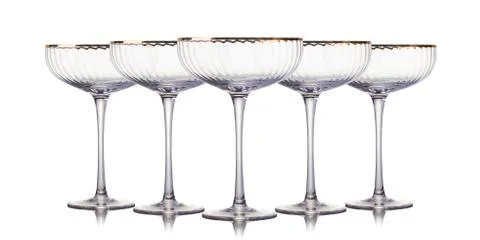 Set of empty champagne glasses in a row isolated on a white background Stock Photos