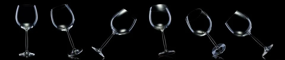 Set of empty glasses for red wine isolated on black background. Illustrazione stock