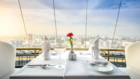 Set of empty glasses in a restaurant and view city Stock Photos