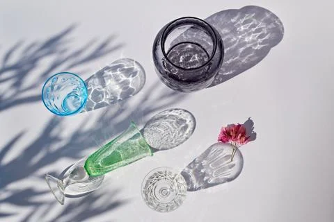 Set of empty glasses with shadows Stock Photos