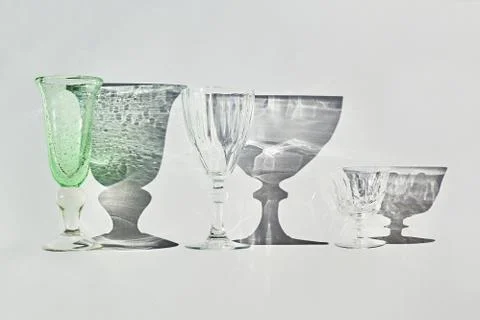 Set of empty glasses with shadows Stock Photos
