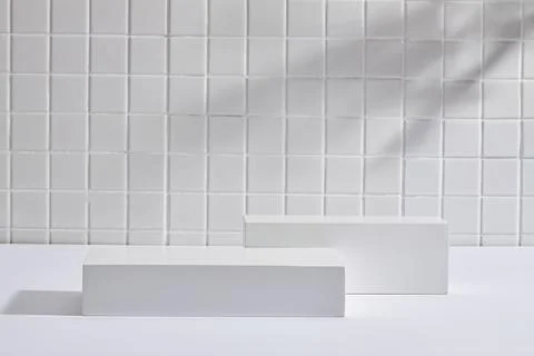A set of empty gray round podiums decorated on mosaic tiles background. Pedes Stock Photos