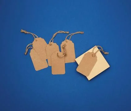 Set of empty paper brown rectangular tags on a rope, price tags set of emp... 写真素材